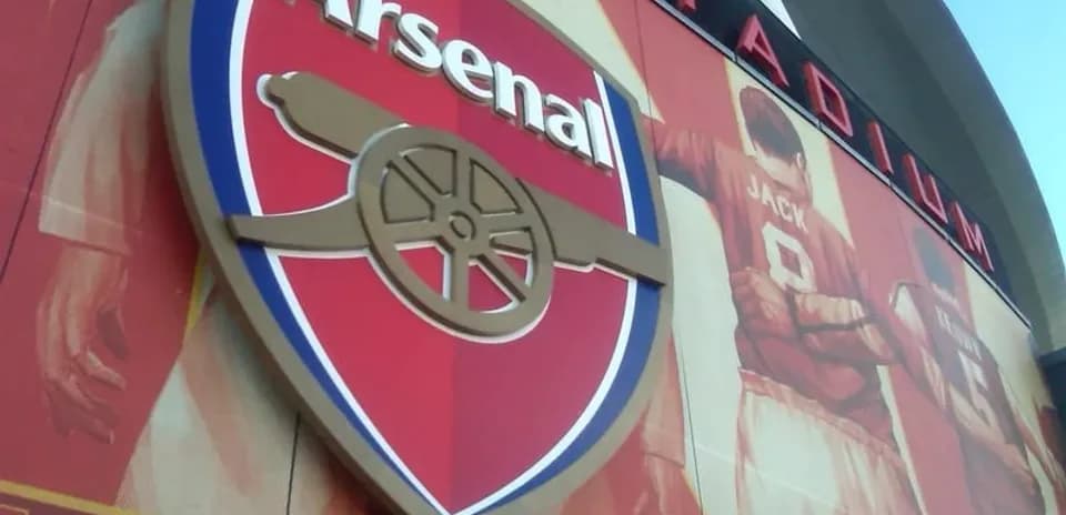 Arsenal logo displayed on stadium wall