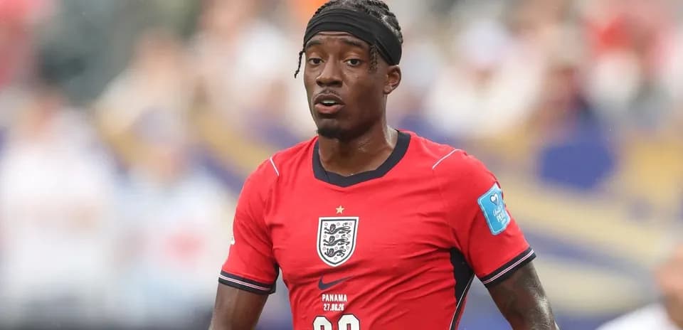 Player in red England kit during match