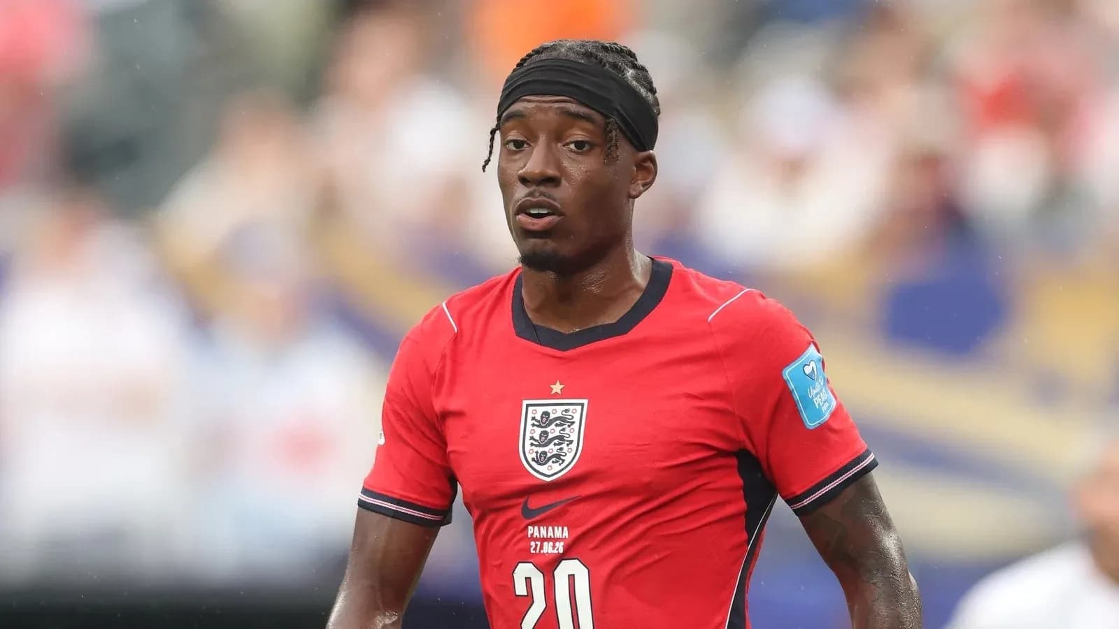 Player in red England kit during match
