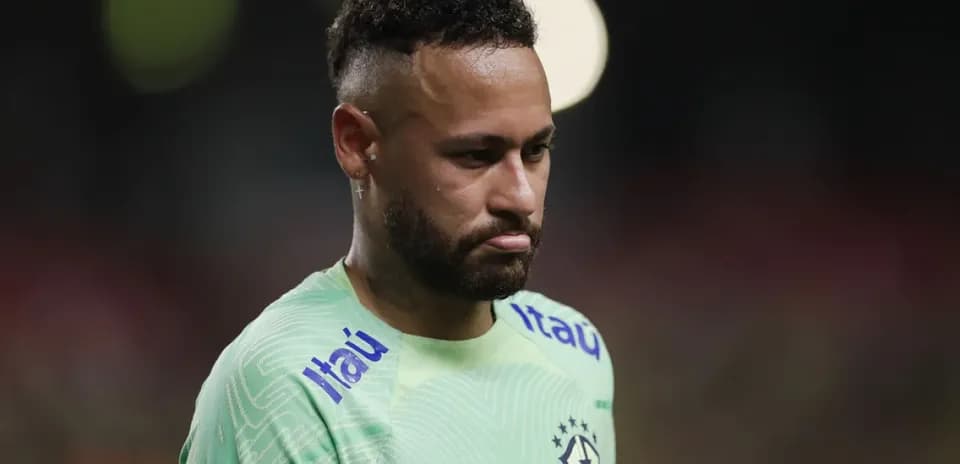 Neymar in Brazil kit during match, looking down