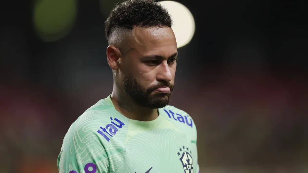 Neymar in Brazil kit during match, looking down
