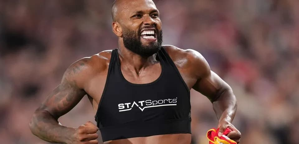 Athlete celebrating with jersey after performance