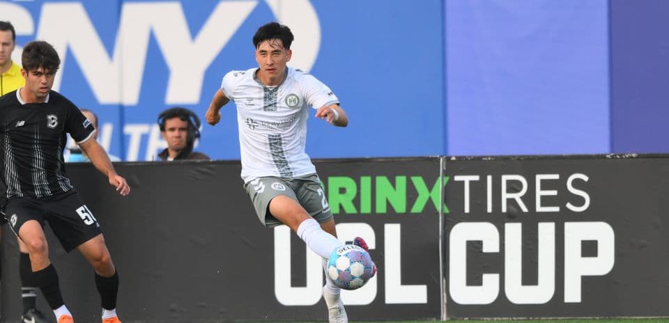 Player dribbling the ball during USL Cup match