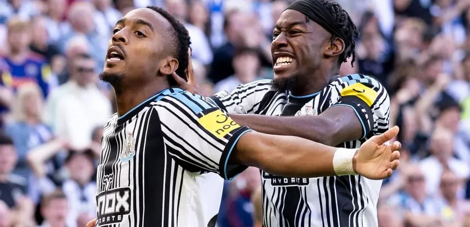 Newcastle players celebrating a goal during match