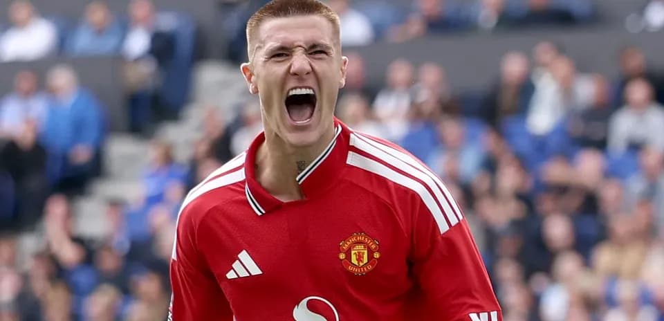 Goalkeeper celebrating during a match with fans