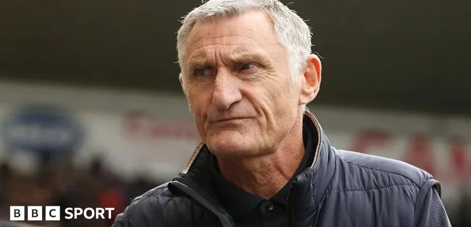 Manager looking focused during a match