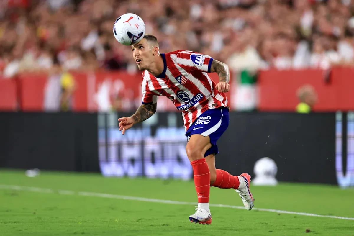 Player heading the ball during a football match