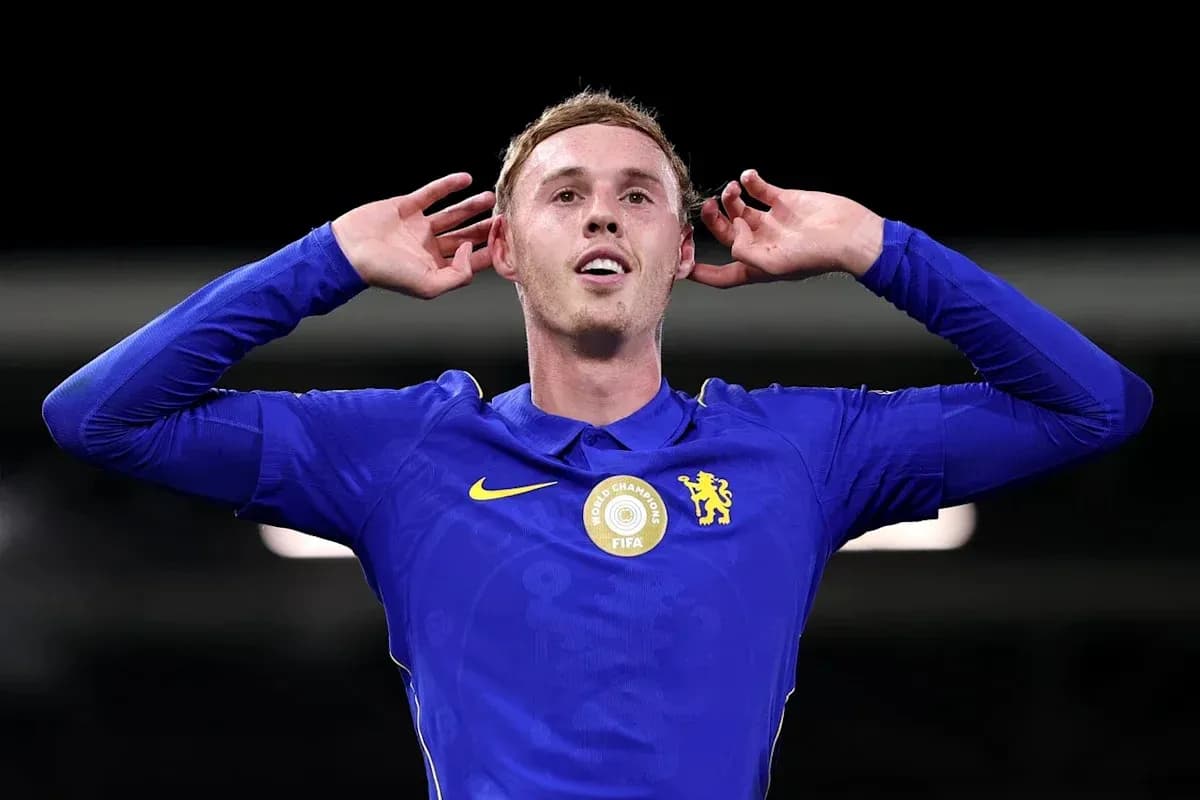 Player celebrating with hands to ears in blue jersey