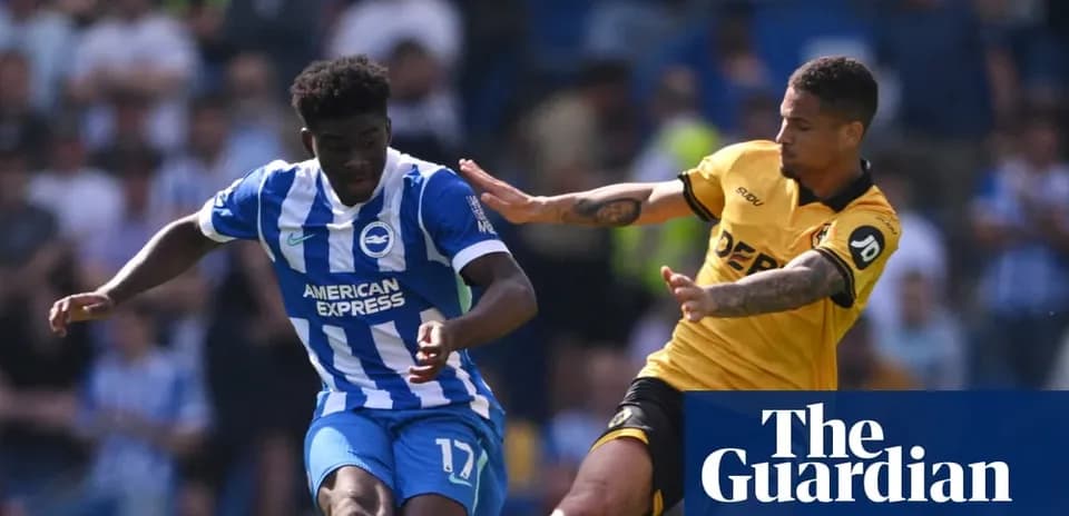 Brighton player evading tackle during match