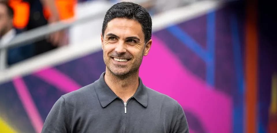 Coach smiling on the sidelines before match