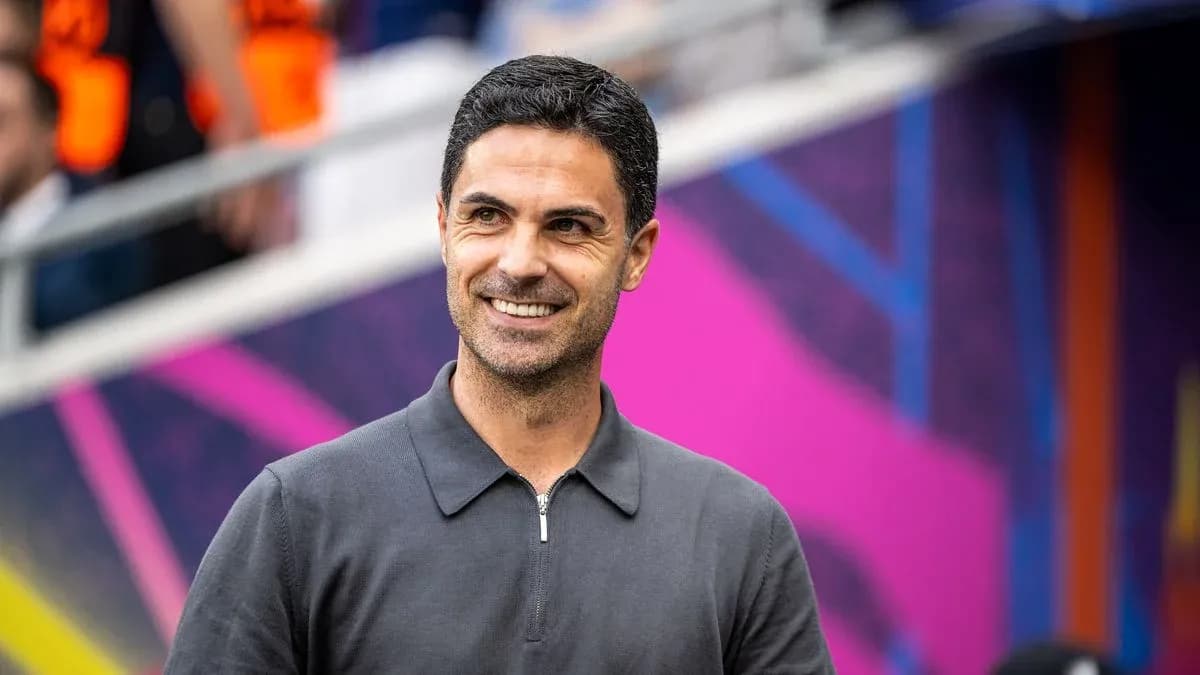 Coach smiling on the sidelines before match