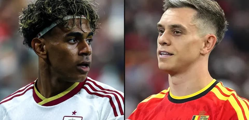 Two football players from Spain and Belgium facing each other