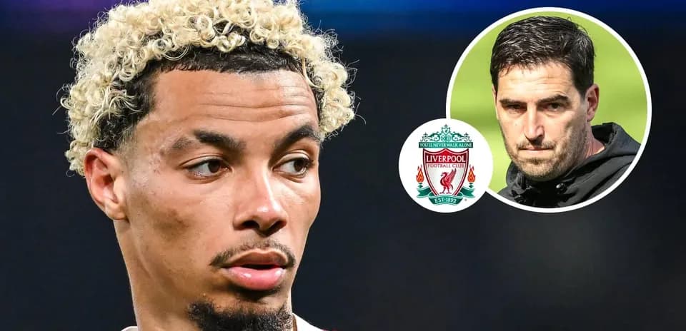 Player with curly hair and Liverpool logo in background