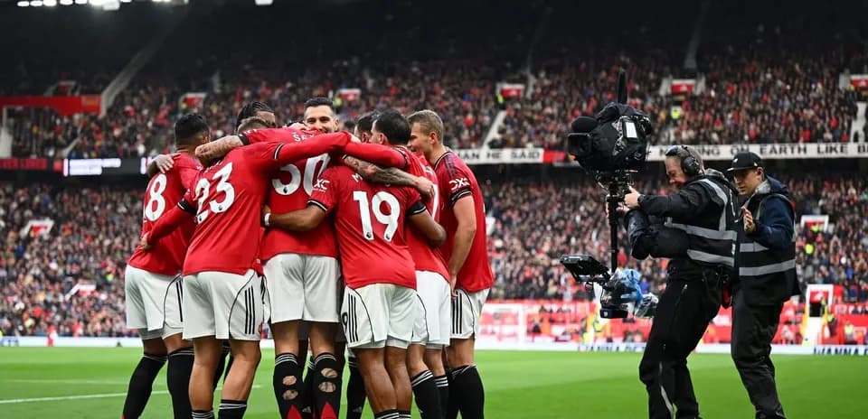 Manchester United players celebrating a goal