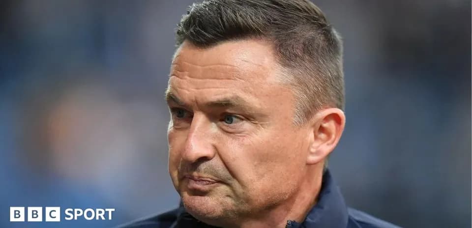 Coach speaking during a pre-match interview