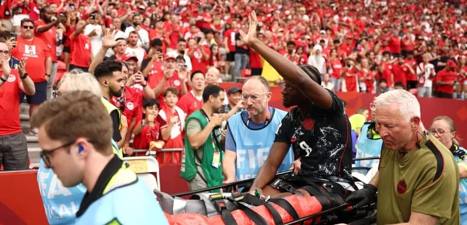 Player being carried off on stretcher during match
