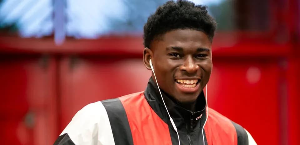 Young athlete smiling while wearing headphones