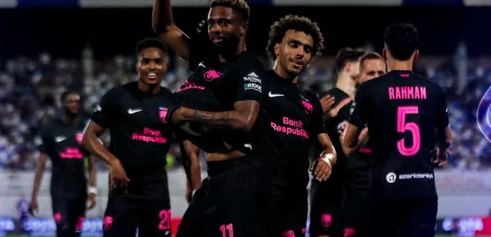 Players celebrating a goal during UEFA Champions League match