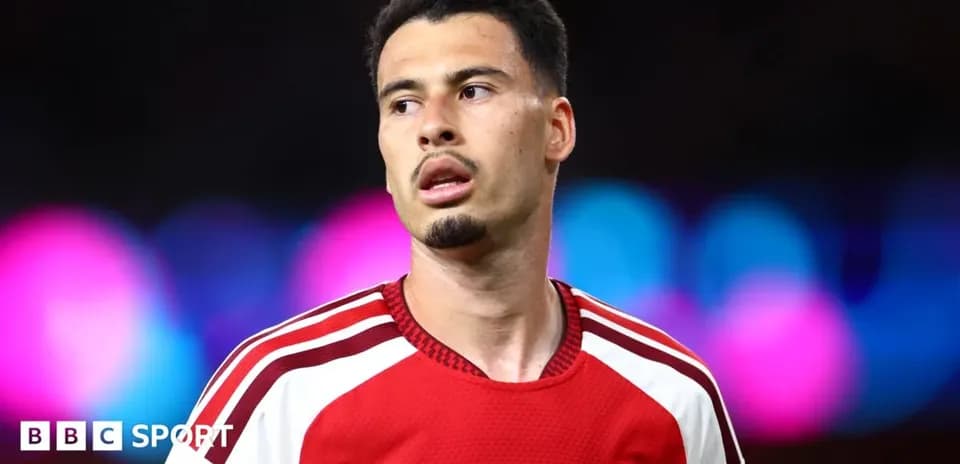 Arsenal player during a match with colorful background