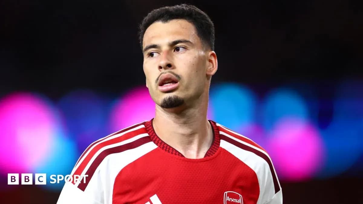 Arsenal player during a match with colorful background