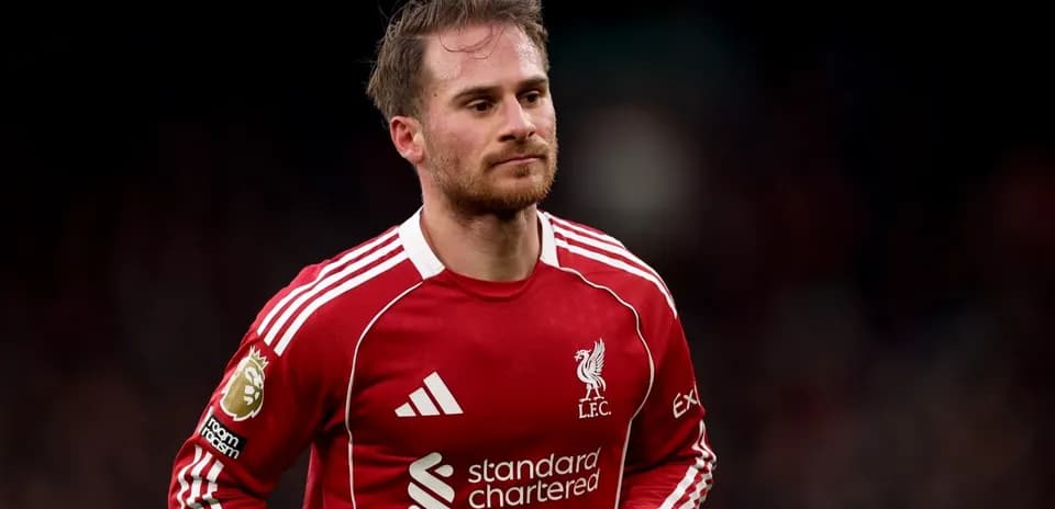 Player wearing Liverpool FC kit on the pitch
