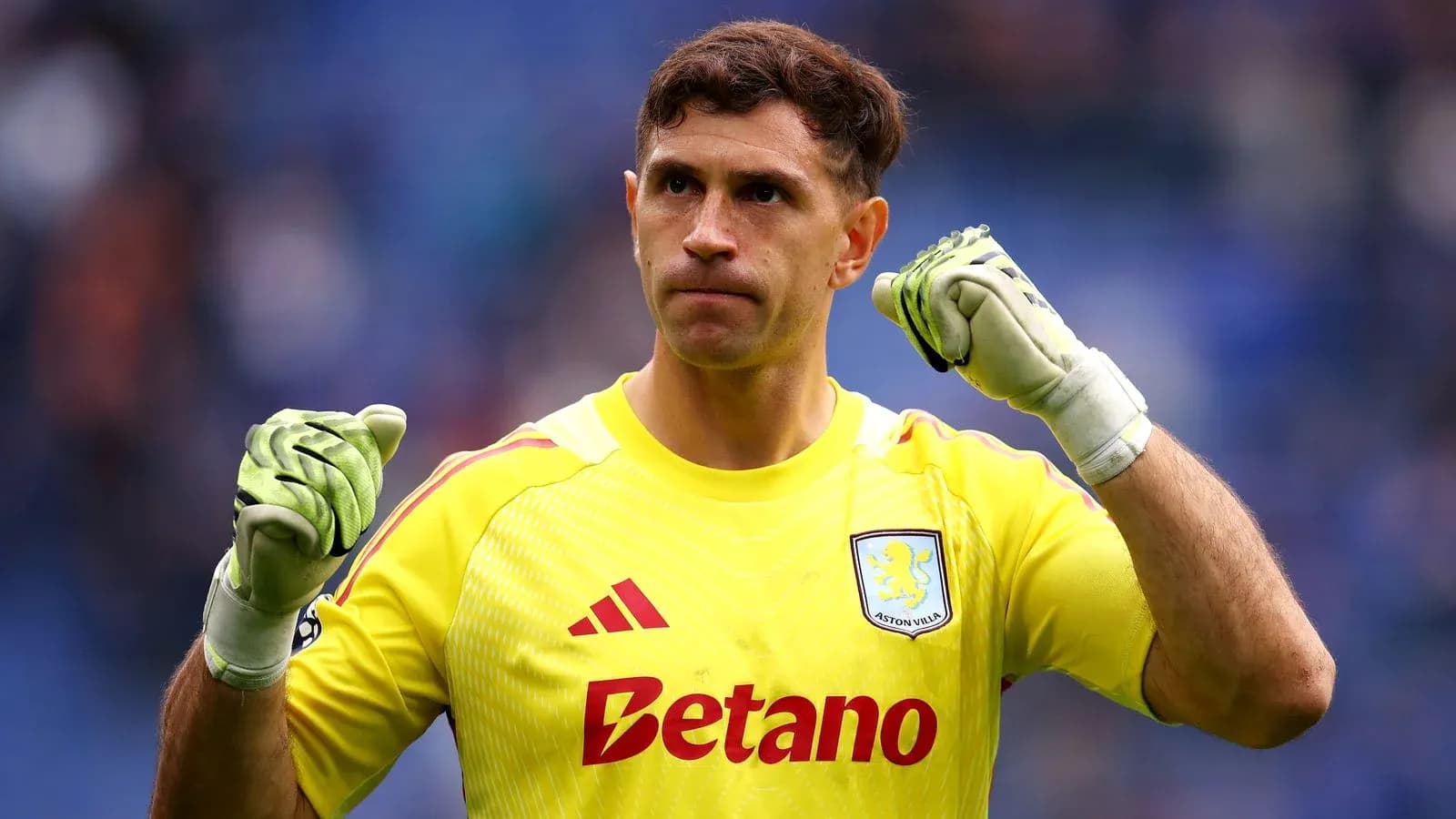 Goalkeeper celebrating with clenched fists in uniform