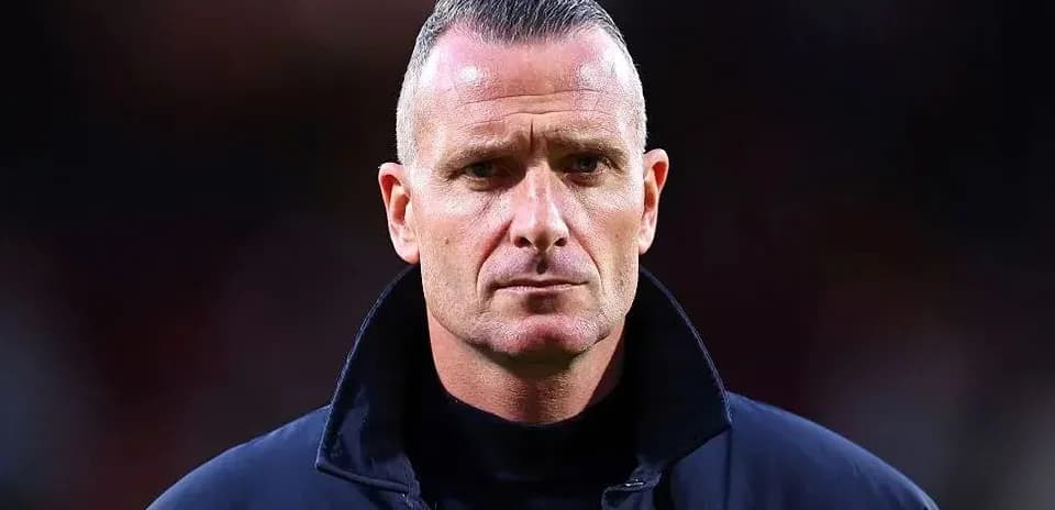 Coach looking serious during match preparation