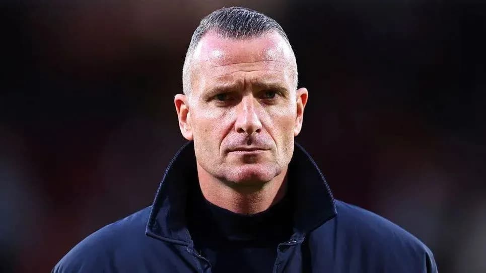 Coach looking serious during match preparation