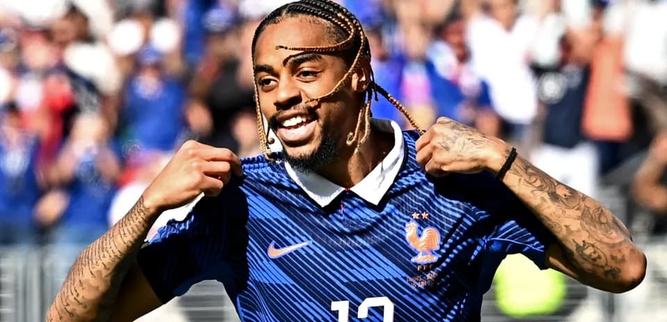 Player celebrating with France jersey after scoring