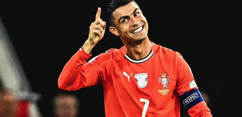 Player celebrating with finger raised in red jersey