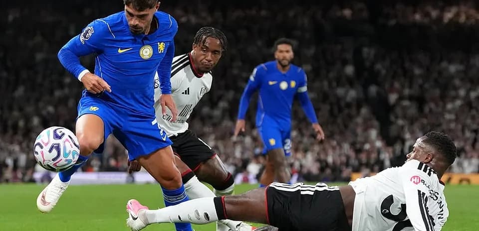 Chelsea player evading tackle during Fulham match