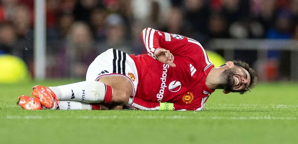 Player lying on pitch in pain during match