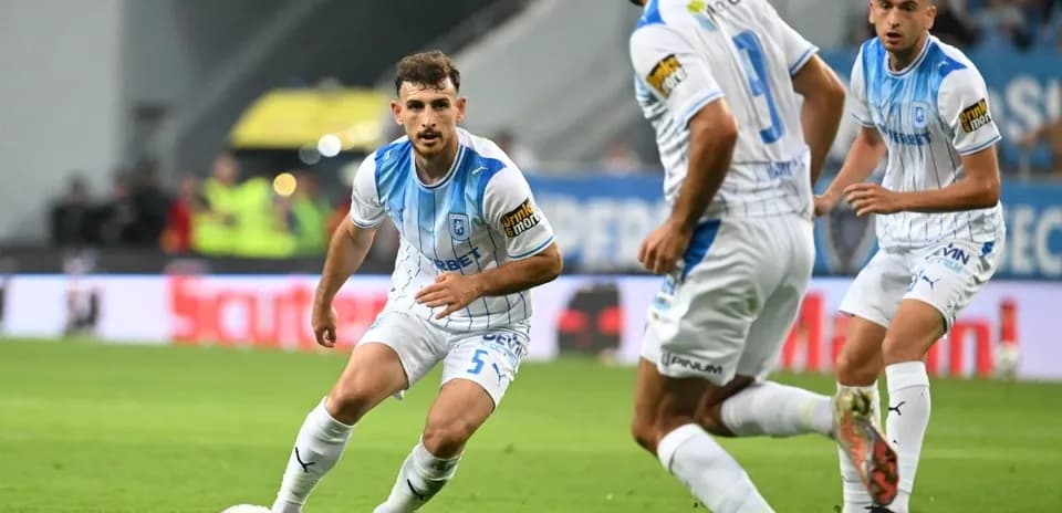 Players from Universitatea Craiova during match action