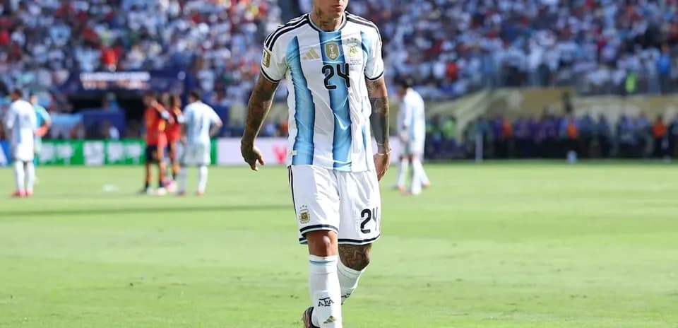 Player walking on field during match in Argentina kit