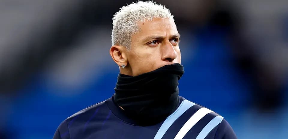 Player warming up with a black scarf around neck