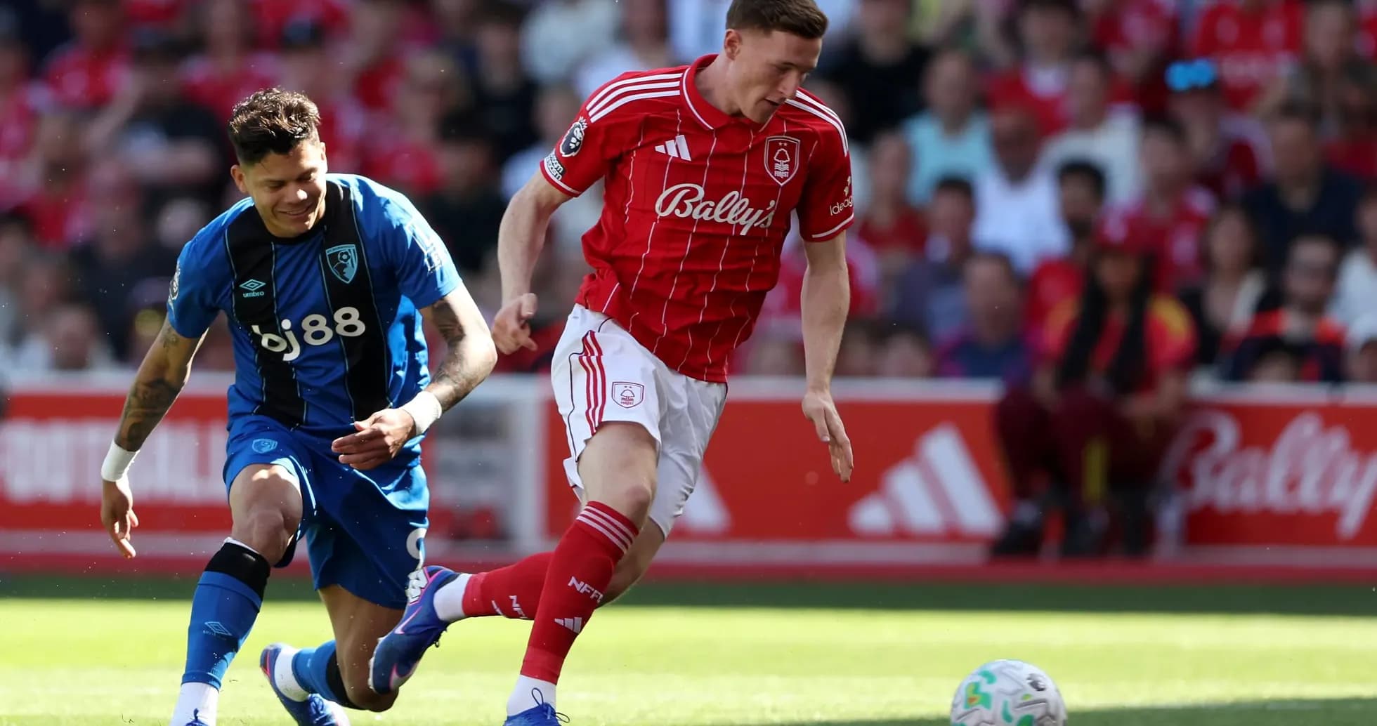 Nottingham Forest player dribbling past Bournemouth defender
