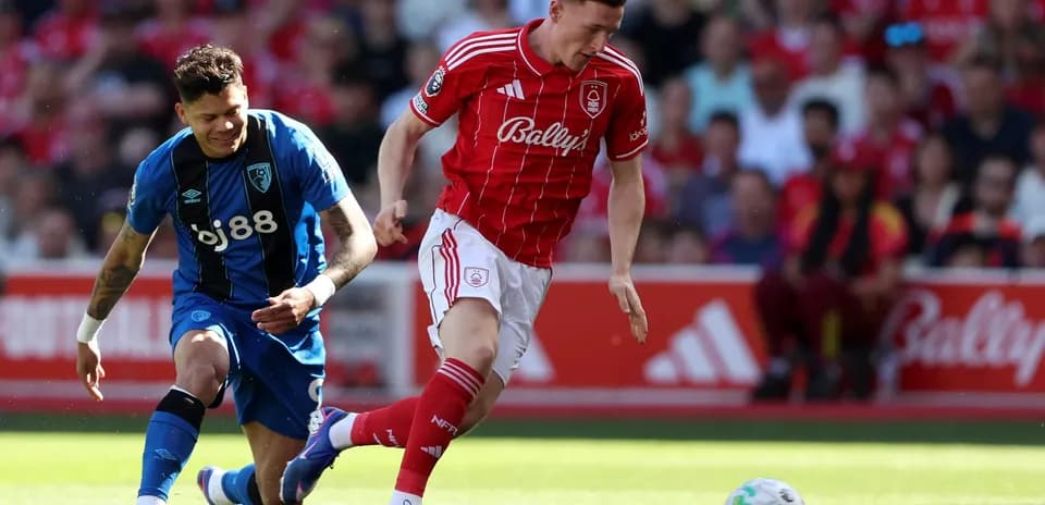 Nottingham Forest player dribbling past Bournemouth defender