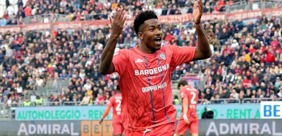 Player celebrating during a match in red jersey