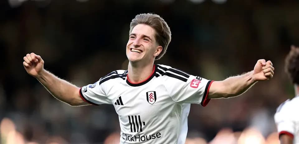 Fulham player celebrating a goal on the field