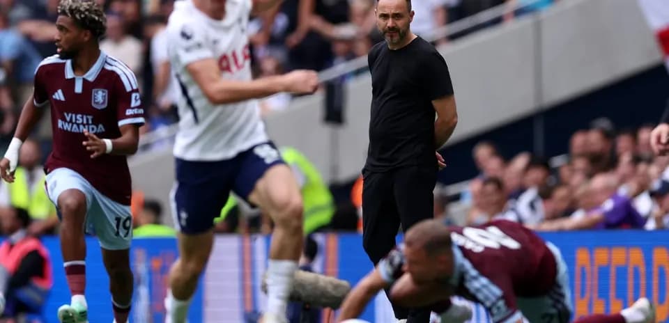 Aston Villa player dribbling past Tottenham players