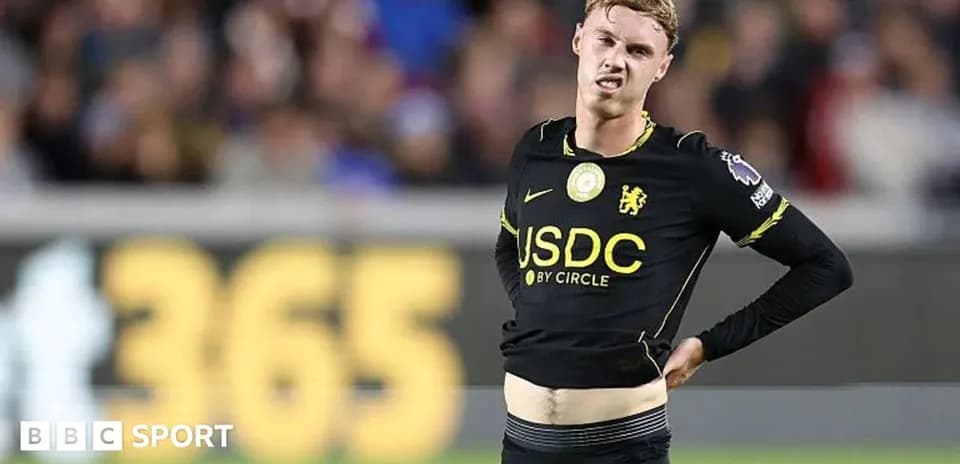 Player adjusting shirt during match on field
