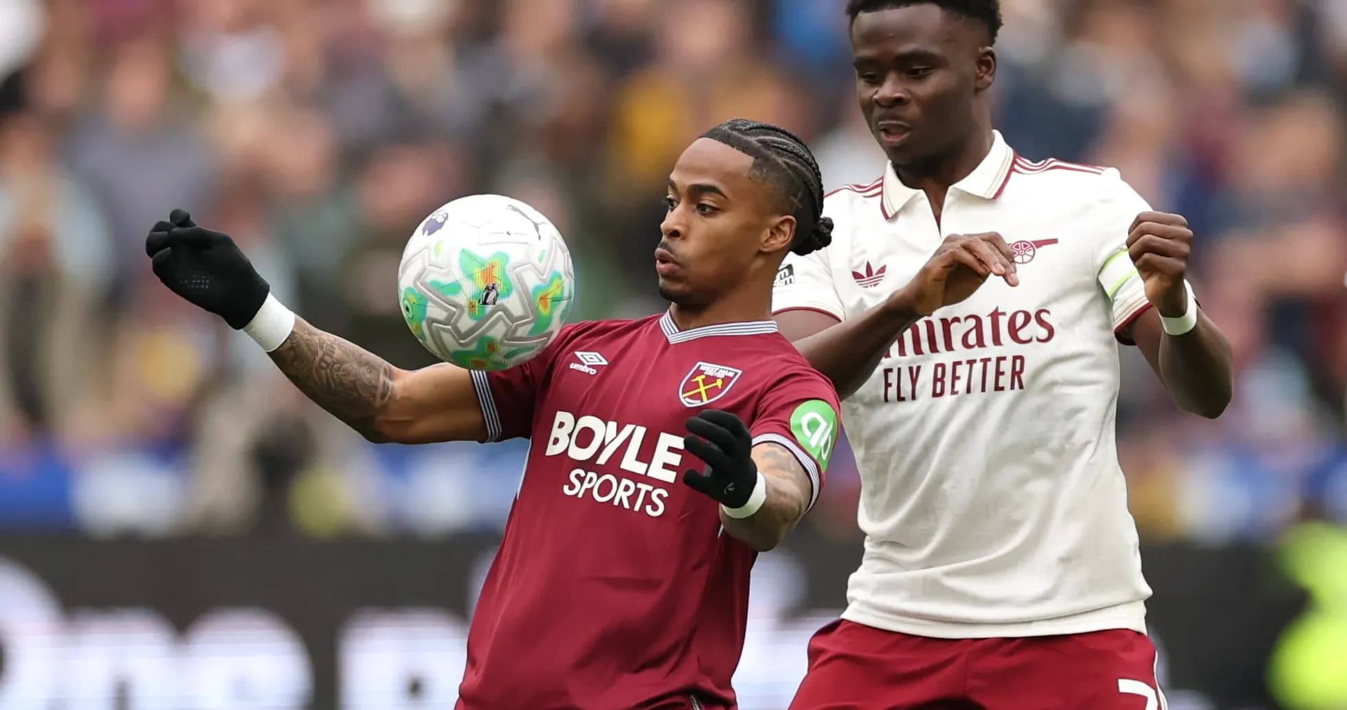 West Ham player controlling the ball against Arsenal