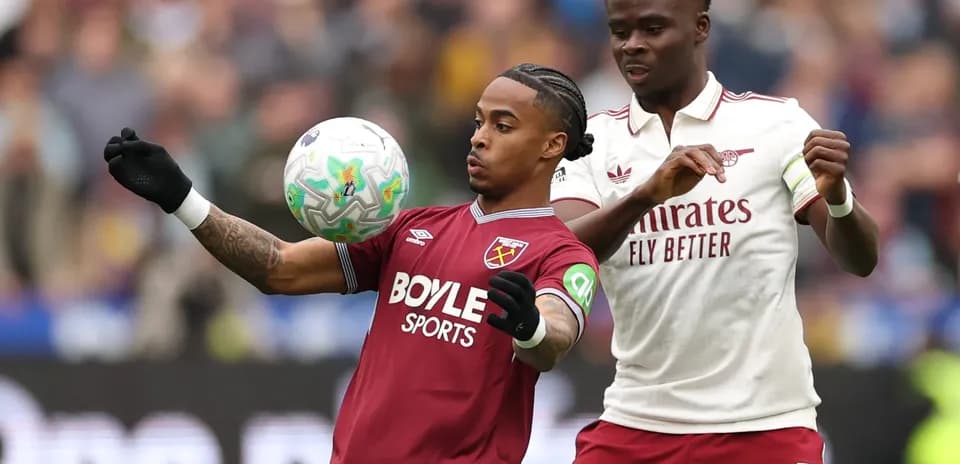 West Ham player controlling the ball against Arsenal