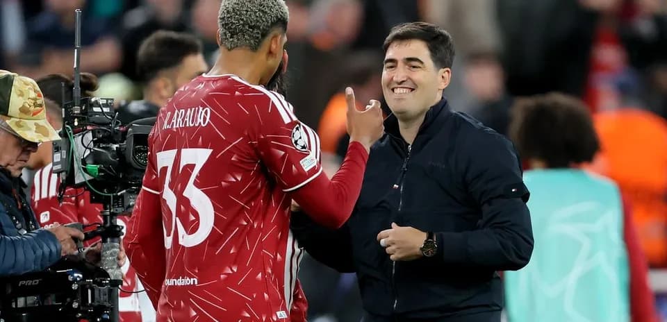 Player and coach interacting during match substitution
