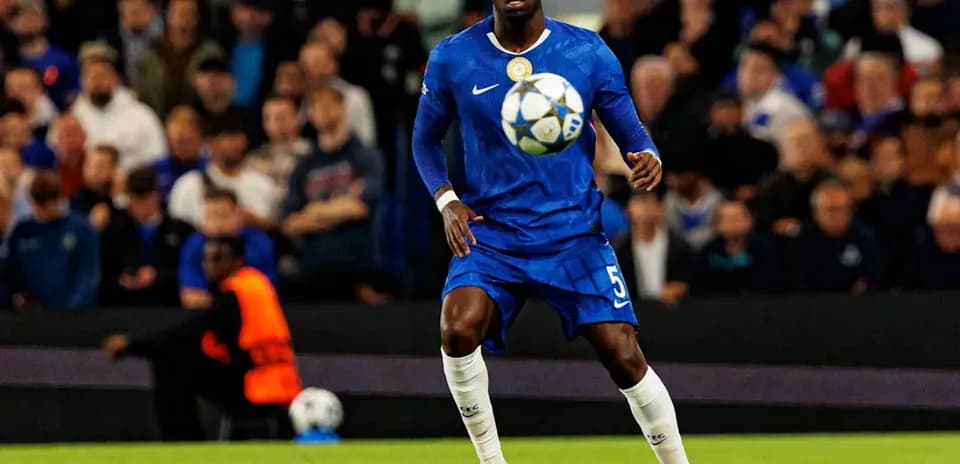 Player in blue kit controlling ball during match