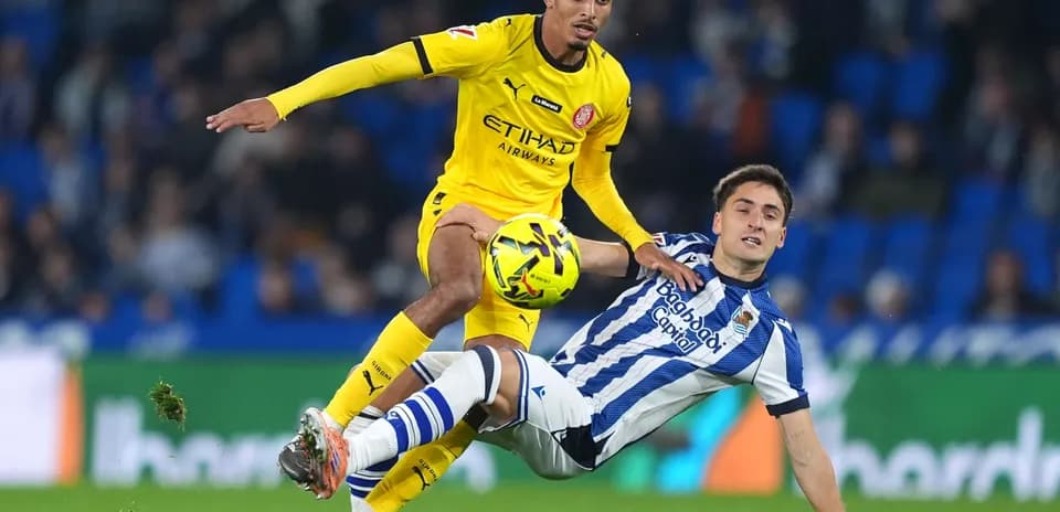 Girona player challenges Real Sociedad opponent