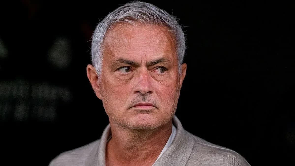 Coach observing from the sidelines during match
