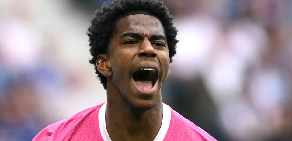 Player in pink jersey celebrating on the field