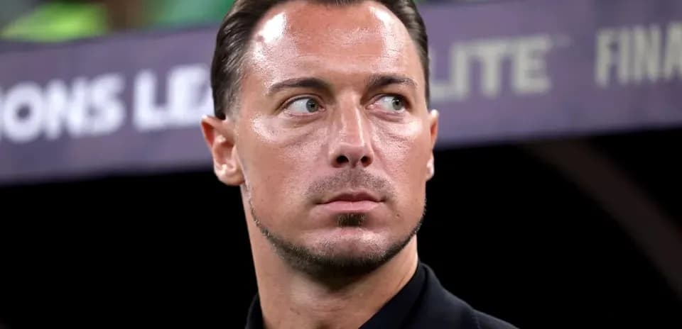 Coach observing the match from the sidelines