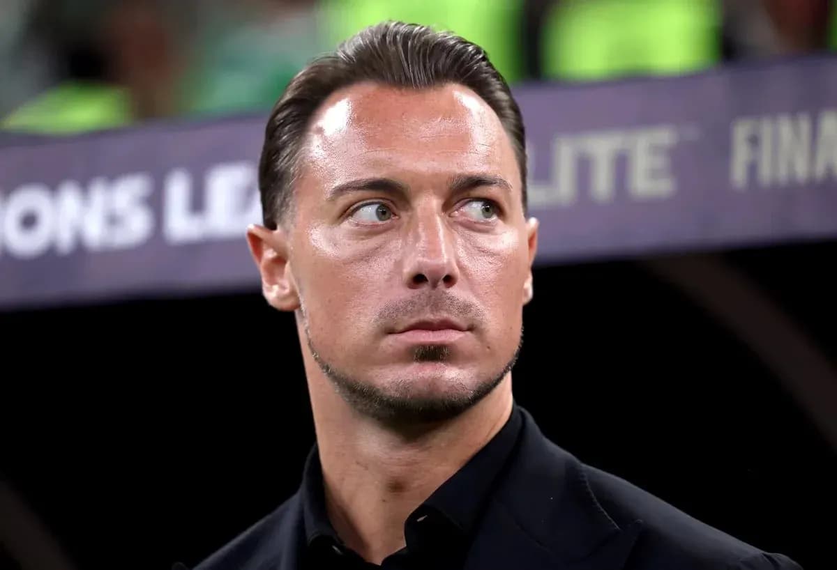 Coach observing the match from the sidelines